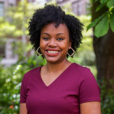 Headshot of Dana Nickson outside of Miller Hall at the University of Washington